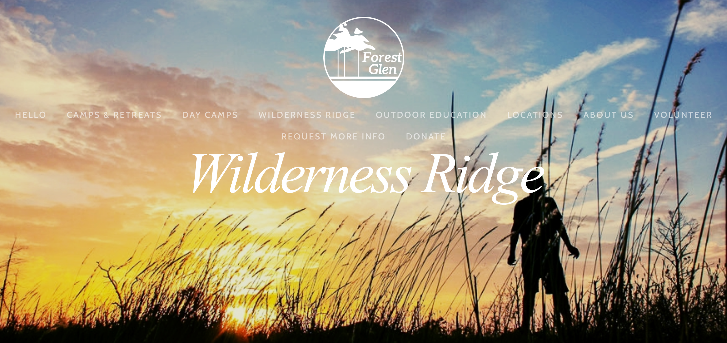 Wilderness Ridge banner with silouette of person against a sunset sky